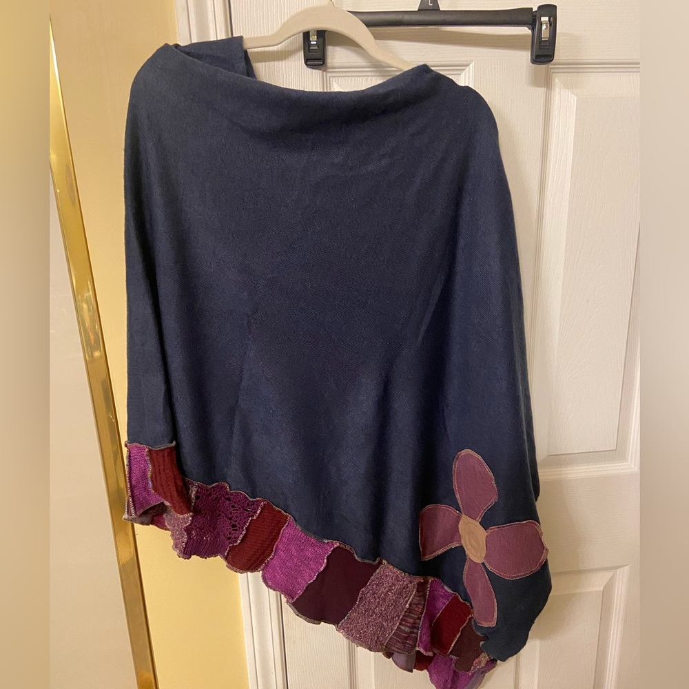 Beautiful handmade poncho fits all sizes with a adorable hand stitched flower…